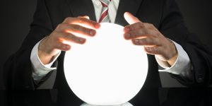 Businessman Predicting Future With Crystal Ball